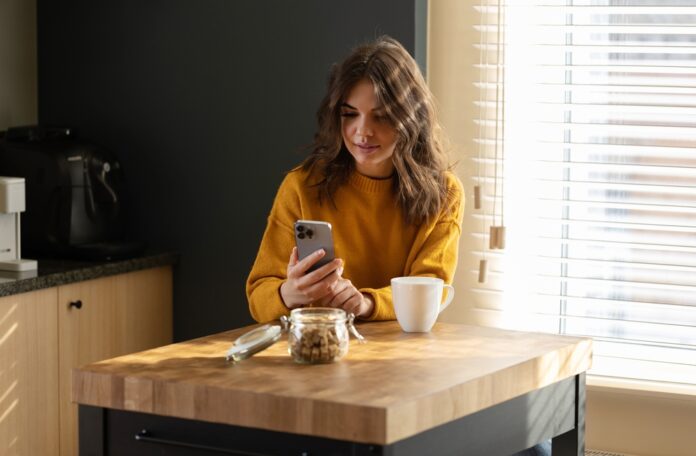 Girl,Working,At,Home,With,A,Iphone,13,Pro,During